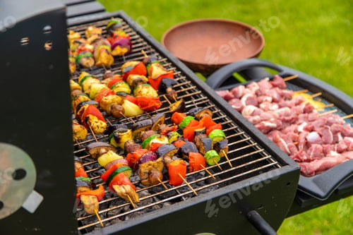 Preview: Vegetables and meat are fried on the grill. Selective focus.