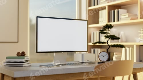 Preview: White screen computer and bonsai pot on a marble top wooden table in a sunlit room with bookshelf.