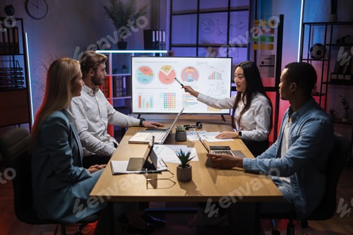 Preview: Four workers discussing economic development of company