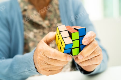 Preview: Alzheimer disease AD, Asian elderly woman patient playing Rubik cube game to practice brain training