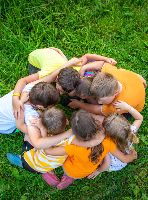 Preview: Children are playing with their hands clasped together. Selective focus.