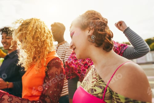 Preview: Happy young people dancing outdoor at festival event - Soft focus on right girl ear