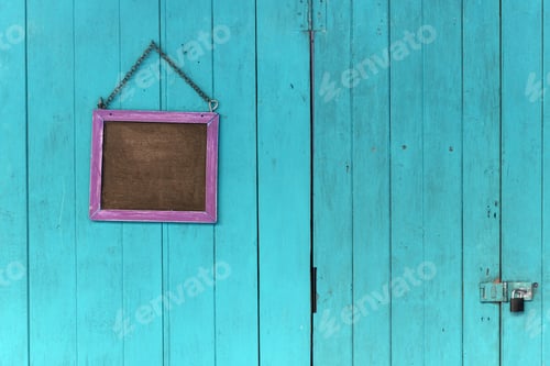 Preview: blackboard hanging on the old wooden door