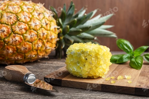 Preview: Cheese with pineapple on a wooden cutting board