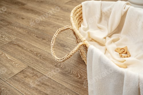 Preview: Muslin blanket and wooden toys in baby cradle
