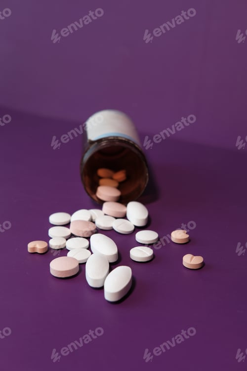 Preview: high angle view of colorful pills on color background