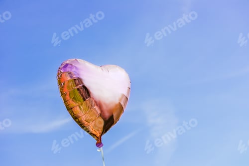 Preview: Heart shaped ballon on the sky background