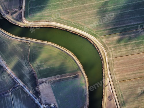 Preview: Drone shot of a river in a field