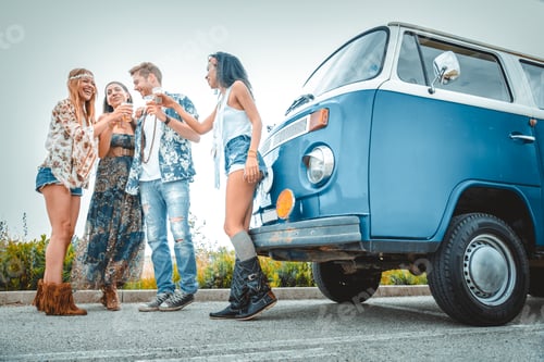 Preview: Happy friends driving a vintage minivan