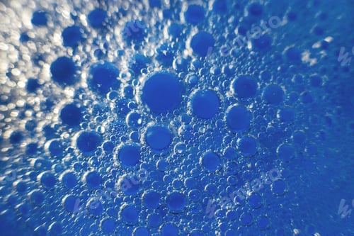 Preview: abstract light blue background with oil circles . bubbles of water close up .