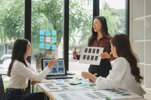 Preview: Web designers working on user interface design for mobile application
