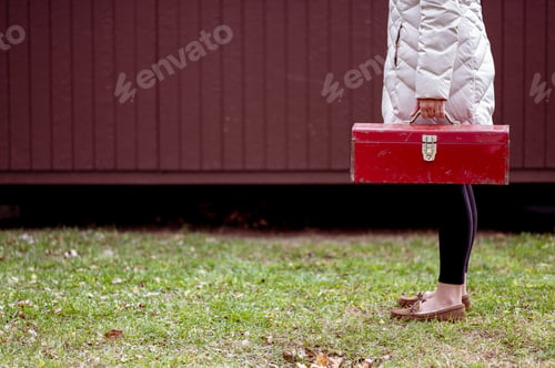 Preview: Closeup shot of a female holding a toolbox