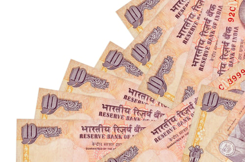 Preview: 10 Indian rupees bills lies in different order isolated on white