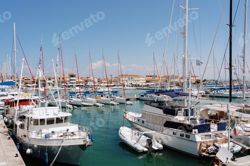 Preview: Vibrant Marina Bustling with Nautical Activity