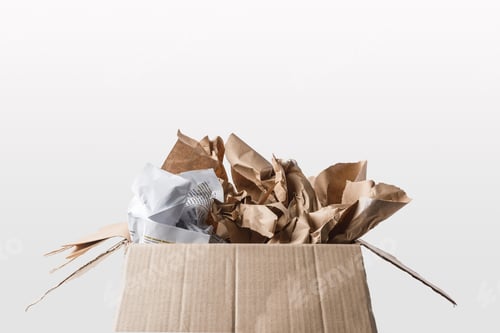 Preview: close up view of cardboard box with papers inside isolated on white