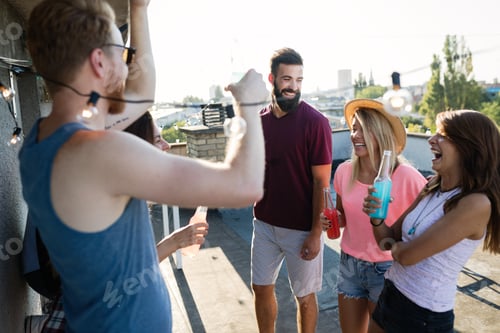 Preview: Happy group of young friends having fun in summer