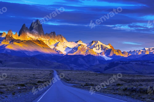 Scenic Road Leading to Majestic Mountain Range