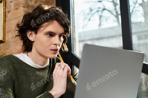 Preview: Engaging young guy immersed in creative thoughts at a cozy cafe during a leisurely afternoon