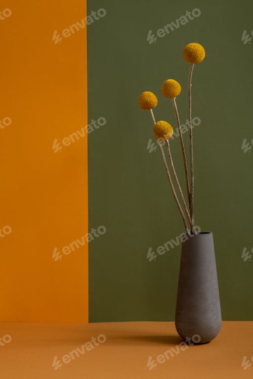 Preview: Four yellow dried wildflowers in grey handmade clay vase standing on table