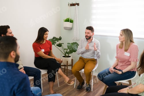 Preview: Diverse people paying attention during group counseling