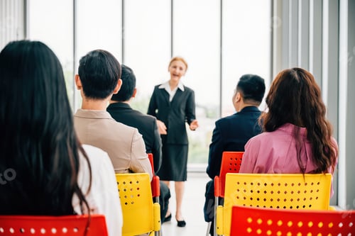 Preview: A confident senior corporate coach, experienced and wise leads a seminar for business team. female