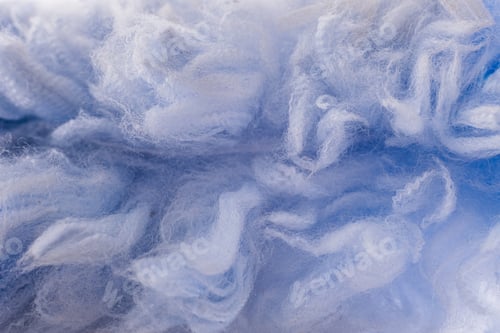 Preview: Macro detail of the blue fibers of a textile garment.