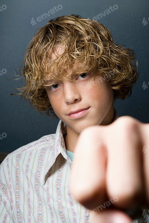 Preview: Teenage boy with fist clenched