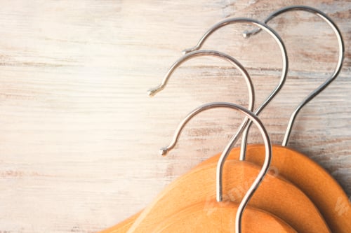 Preview: Wooden Clothes Hangers on Rustic White Background