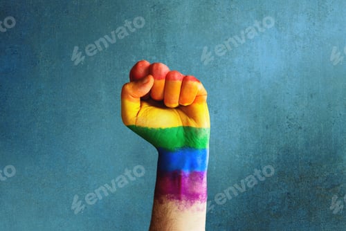 Preview: Raised rainbow fist of a man for PRIDE month and the LGBTQIA+ movement