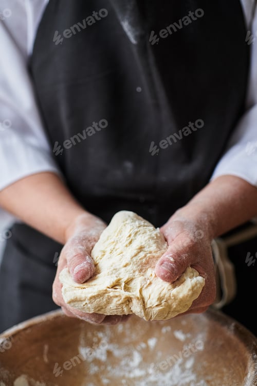 Preview: Baker hands kneading dough