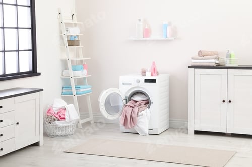 Preview: Bathroom interior with dirty towels in washing machine