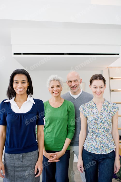 Preview: 4 business people looking at viewer