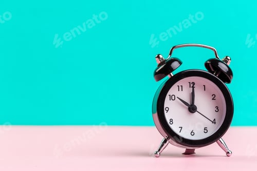 Preview: black vintage alarm clock on color background