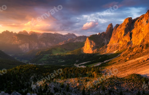 Preview: Mountains at beautiful golden sunset in summer. Colorful landscape