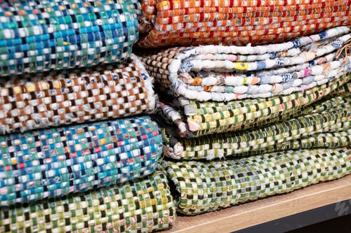 Preview: A woven rug made of old things. Eco-friendly development. Reuse of items. Handmade work.