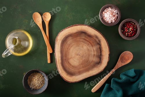 Preview: empty serving board salt pepper spoon on green background