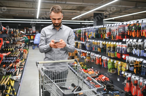 Preview: Portrait of happy mature man standing in hardware store