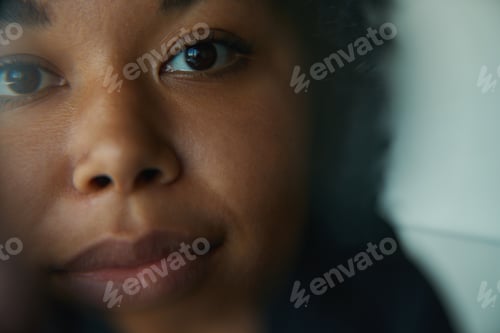 Preview: Close-up of a young female face with a blurred background