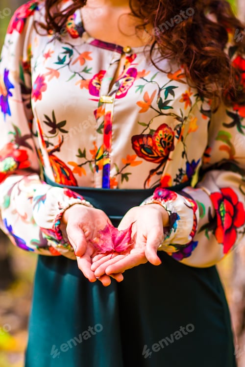 Preview: girl in autumn park with leaves