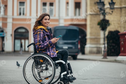 Preview: Woman with disability using a smartphone while out in the city