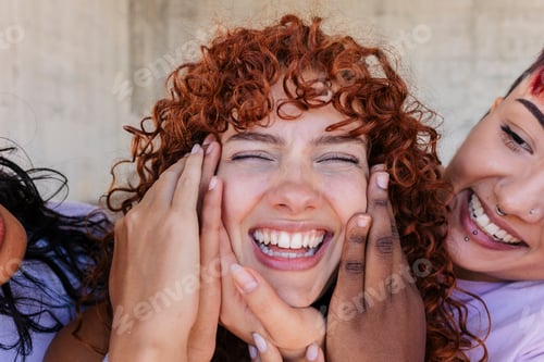 Preview: Three happy friends holding cheeks and smiling with closed eyes