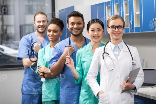 Preview: group of smiling medical workers with equipment in laboratory