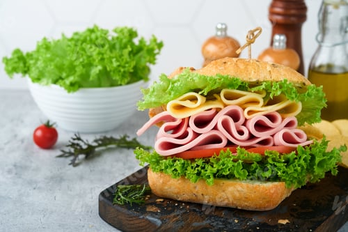 Preview: Sandwich. Tasty sandwich with ham or bacon, cheese, tomatoes, lettuce and grain bread. Delicious clu