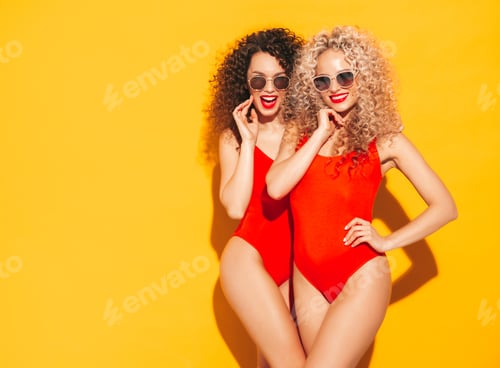 Preview: Two hot beautiful women posing in studio