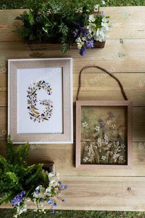 Preview: Floral letter G in wooden frame, decorations for a woodland naming ceremony.