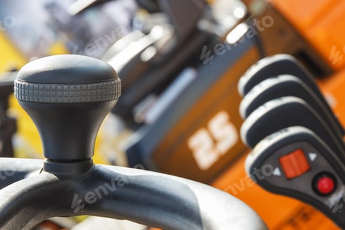 Preview: Steering wheel and operating control panels or levers with buttons in forklift