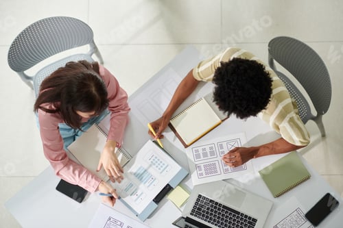 Preview: UI and UX Designers Discussing App Project