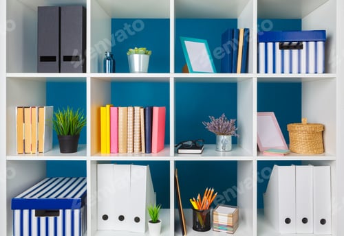 Preview: White office shelves with different stationery, close up
