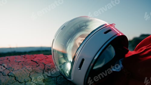 Preview: Tired Astronaut Sleeps On Mountain Wasteland Exhausted In New Lifeless Planet