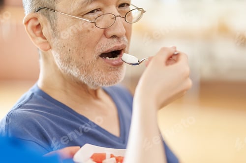 Preview: A caregiver who assists the elderly with meals